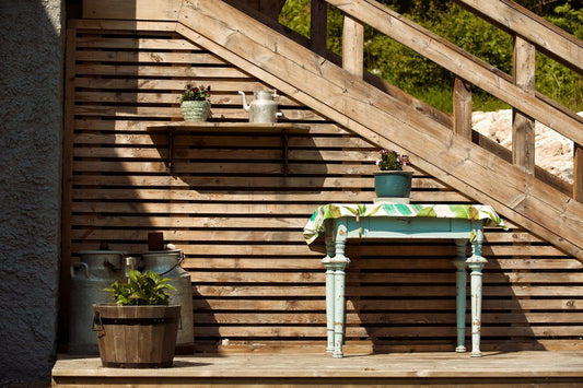 a small table with a potted plant on top of it