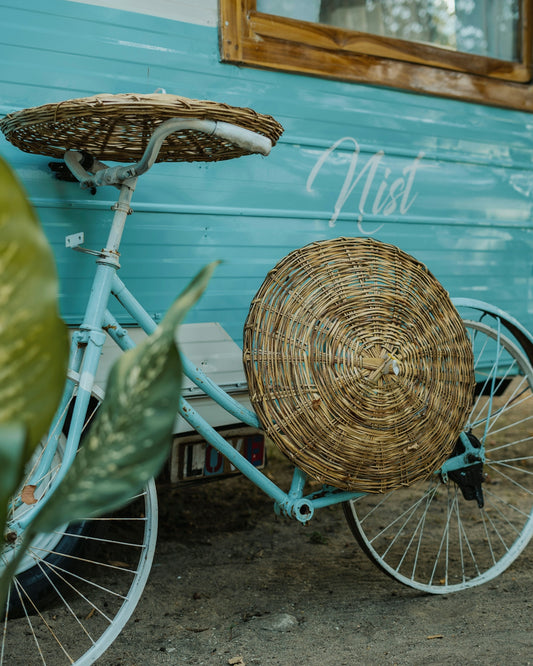 A bicycle with a basket on the back of it