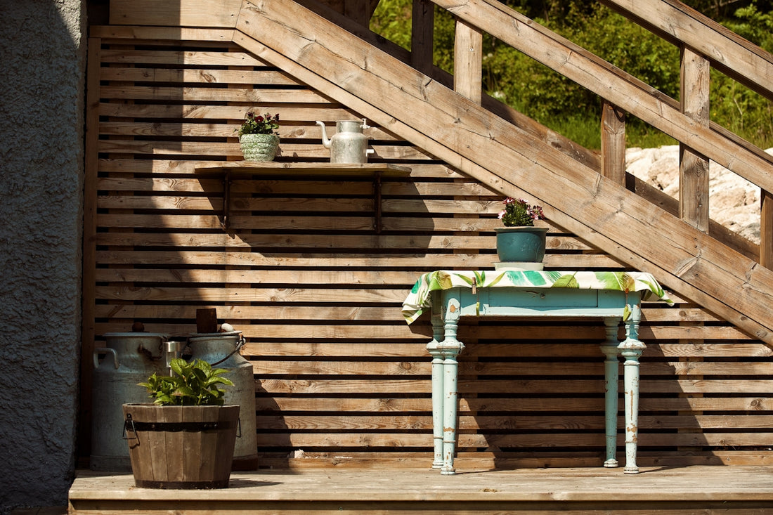 a small table with a potted plant on top of it